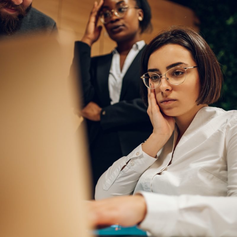 Stressed business team having a meeting in the office and solving a problem